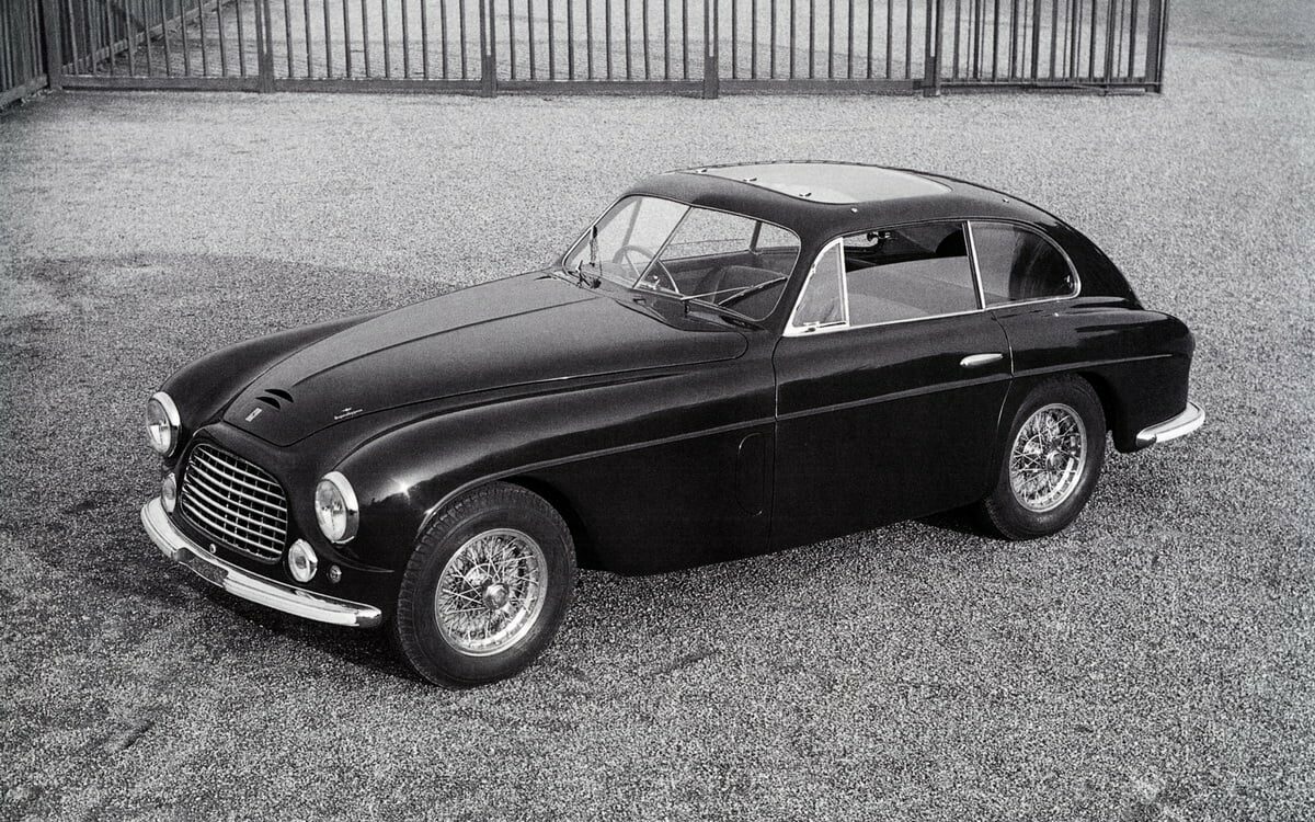 Ferrari 166 Inter Touring Berlinetta 047S fitted with an Aerlux sunroof, and finished in a dark blue with red interior. In July of 1950 the car was sold to Luigi Pomini of Varese, Italy.